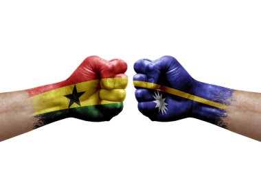 Two hands punch to each others on white background. Country flags painted fists, conflict crisis concept between ghana and nauru