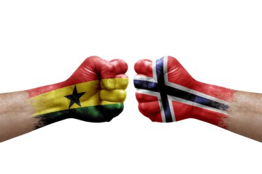 Two hands punch to each others on white background. Country flags painted fists, conflict crisis concept between ghana and norway
