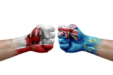 Two hands punch to each others on white background. Country flags painted fists, conflict crisis concept between gibraltar and tuvalu