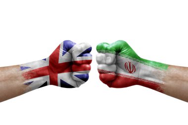 Two hands punch to each others on white background. Country flags painted fists, conflict crisis concept between great britain and iran