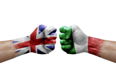 Two hands punch to each others on white background. Country flags painted fists, conflict crisis concept between great britain and italy