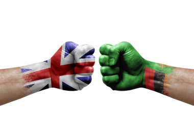Two hands punch to each others on white background. Country flags painted fists, conflict crisis concept between great britain and zambia