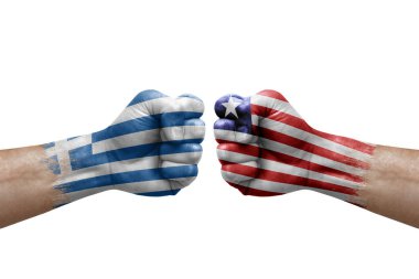 Two hands punch to each others on white background. Country flags painted fists, conflict crisis concept between greece and liberia