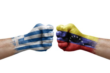 Two hands punch to each others on white background. Country flags painted fists, conflict crisis concept between greece and venezuela