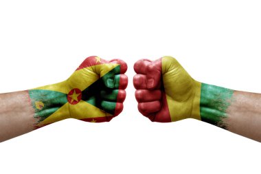 Two hands punch to each others on white background. Country flags painted fists, conflict crisis concept between grenada and guinea