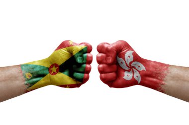 Two hands punch to each others on white background. Country flags painted fists, conflict crisis concept between grenada and hong kong