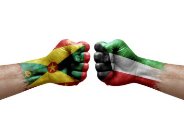 Two hands punch to each others on white background. Country flags painted fists, conflict crisis concept between grenada and kuwait
