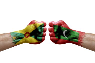 Two hands punch to each others on white background. Country flags painted fists, conflict crisis concept between grenada and maldives