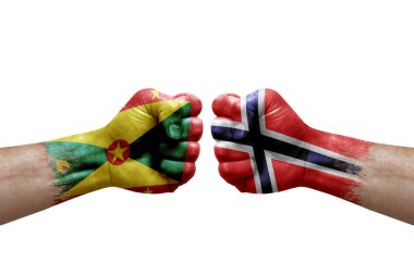 Two hands punch to each others on white background. Country flags painted fists, conflict crisis concept between grenada and norway