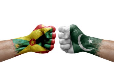 Two hands punch to each others on white background. Country flags painted fists, conflict crisis concept between grenada and pakistan