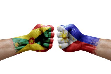 Two hands punch to each others on white background. Country flags painted fists, conflict crisis concept between grenada and philippines