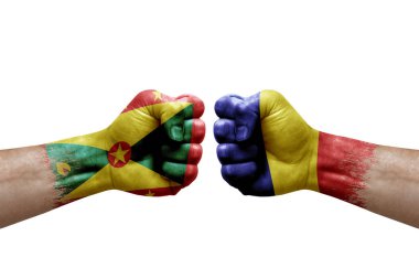 Two hands punch to each others on white background. Country flags painted fists, conflict crisis concept between grenada and romania