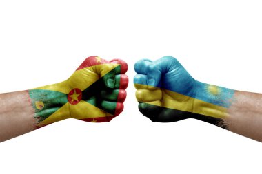 Two hands punch to each others on white background. Country flags painted fists, conflict crisis concept between grenada and rwanda