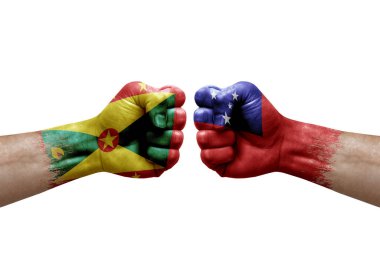 Two hands punch to each others on white background. Country flags painted fists, conflict crisis concept between grenada and samoa