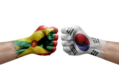 Two hands punch to each others on white background. Country flags painted fists, conflict crisis concept between grenada and south korea