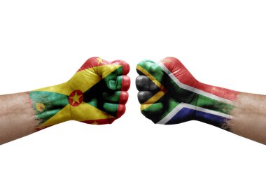 Two hands punch to each others on white background. Country flags painted fists, conflict crisis concept between grenada and south africa