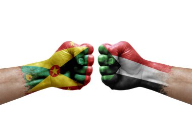 Two hands punch to each others on white background. Country flags painted fists, conflict crisis concept between grenada and sudan