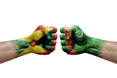 Two hands punch to each others on white background. Country flags painted fists, conflict crisis concept between grenada and turkmenistan