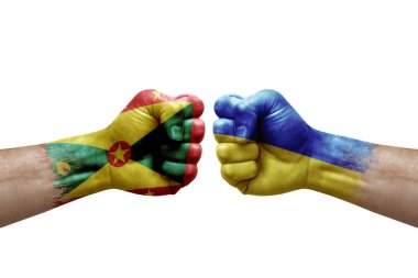 Two hands punch to each others on white background. Country flags painted fists, conflict crisis concept between grenada and ukraine