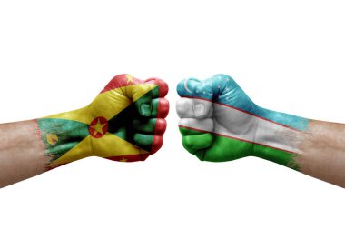 Two hands punch to each others on white background. Country flags painted fists, conflict crisis concept between grenada and uzbekistan