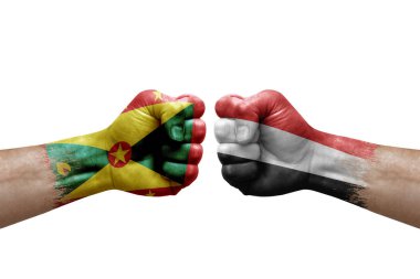 Two hands punch to each others on white background. Country flags painted fists, conflict crisis concept between grenada and yemen