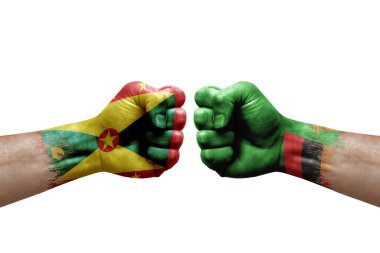Two hands punch to each others on white background. Country flags painted fists, conflict crisis concept between grenada and zambia