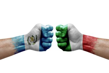 Two hands punch to each others on white background. Country flags painted fists, conflict crisis concept between guatemala and italy
