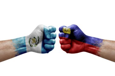 Two hands punch to each others on white background. Country flags painted fists, conflict crisis concept between guatemala and liechtenstein