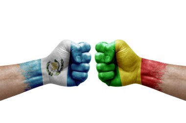 Two hands punch to each others on white background. Country flags painted fists, conflict crisis concept between guatemala and mali