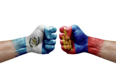 Two hands punch to each others on white background. Country flags painted fists, conflict crisis concept between guatemala and mongolia