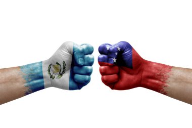 Two hands punch to each others on white background. Country flags painted fists, conflict crisis concept between guatemala and samoa