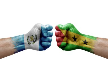 Two hands punch to each others on white background. Country flags painted fists, conflict crisis concept between guatemala and sao tome and principe
