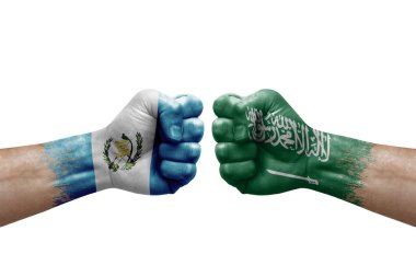 Two hands punch to each others on white background. Country flags painted fists, conflict crisis concept between guatemala and saudi arabia