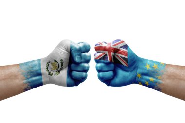 Two hands punch to each others on white background. Country flags painted fists, conflict crisis concept between guatemala and tuvalu