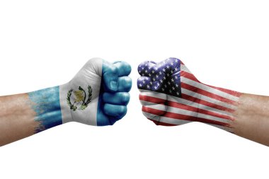 Two hands punch to each others on white background. Country flags painted fists, conflict crisis concept between guatemala and usa