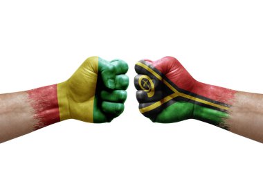 Two hands punch to each others on white background. Country flags painted fists, conflict crisis concept between guinea and vanuatu