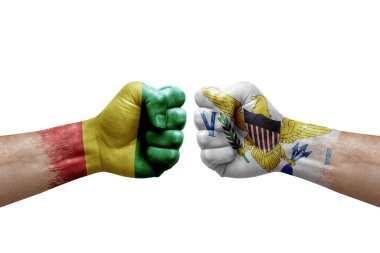 Two hands punch to each others on white background. Country flags painted fists, conflict crisis concept between guinea and virgin islands