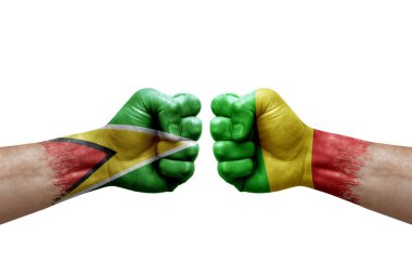 Two hands punch to each others on white background. Country flags painted fists, conflict crisis concept between guyana and mali