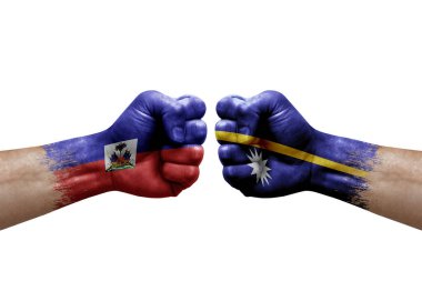 Two hands punch to each others on white background. Country flags painted fists, conflict crisis concept between haiti and nauru