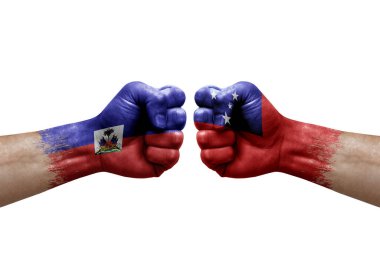 Two hands punch to each others on white background. Country flags painted fists, conflict crisis concept between haiti and samoa