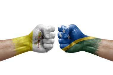 Two hands punch to each others on white background. Country flags painted fists, conflict crisis concept between holy see and solomon islands