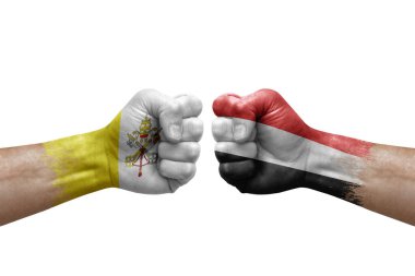 Two hands punch to each others on white background. Country flags painted fists, conflict crisis concept between holy see and yemen