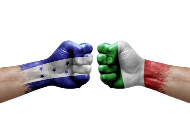 Two hands punch to each others on white background. Country flags painted fists, conflict crisis concept between honduras and italy