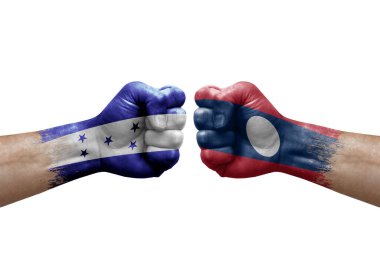 Two hands punch to each others on white background. Country flags painted fists, conflict crisis concept between honduras and laos