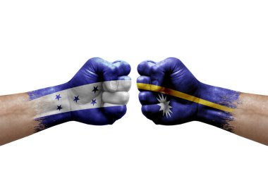 Two hands punch to each others on white background. Country flags painted fists, conflict crisis concept between honduras and nauru