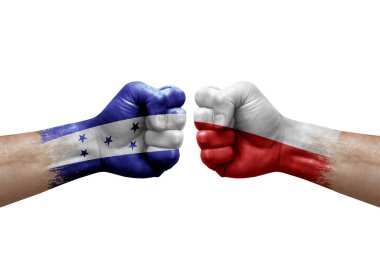 Two hands punch to each others on white background. Country flags painted fists, conflict crisis concept between honduras and poland