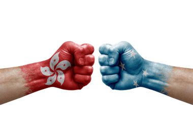 Two hands punch to each others on white background. Country flags painted fists, conflict crisis concept between hong kong and micronesia