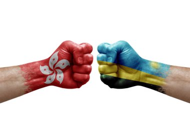 Two hands punch to each others on white background. Country flags painted fists, conflict crisis concept between hong kong and rwanda