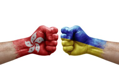 Two hands punch to each others on white background. Country flags painted fists, conflict crisis concept between hong kong and ukraine