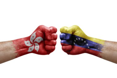 Two hands punch to each others on white background. Country flags painted fists, conflict crisis concept between hong kong and venezuela